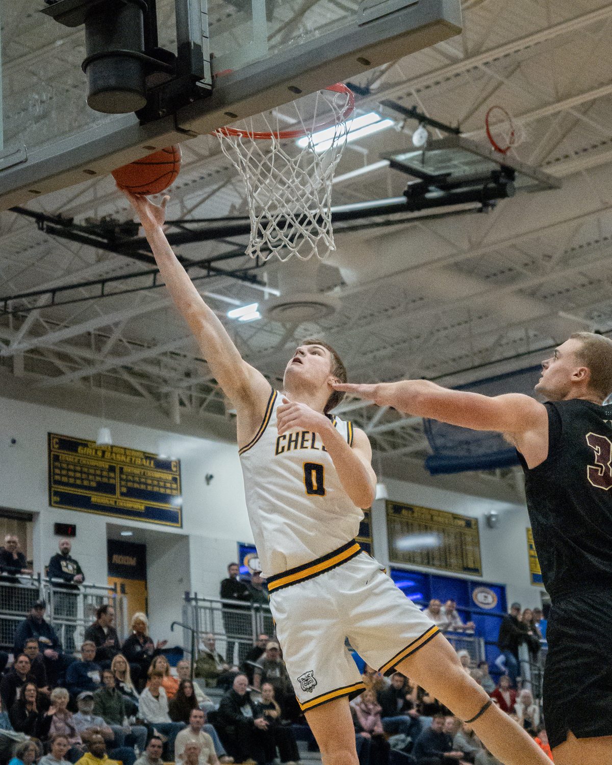 Basketball player driving for a layup