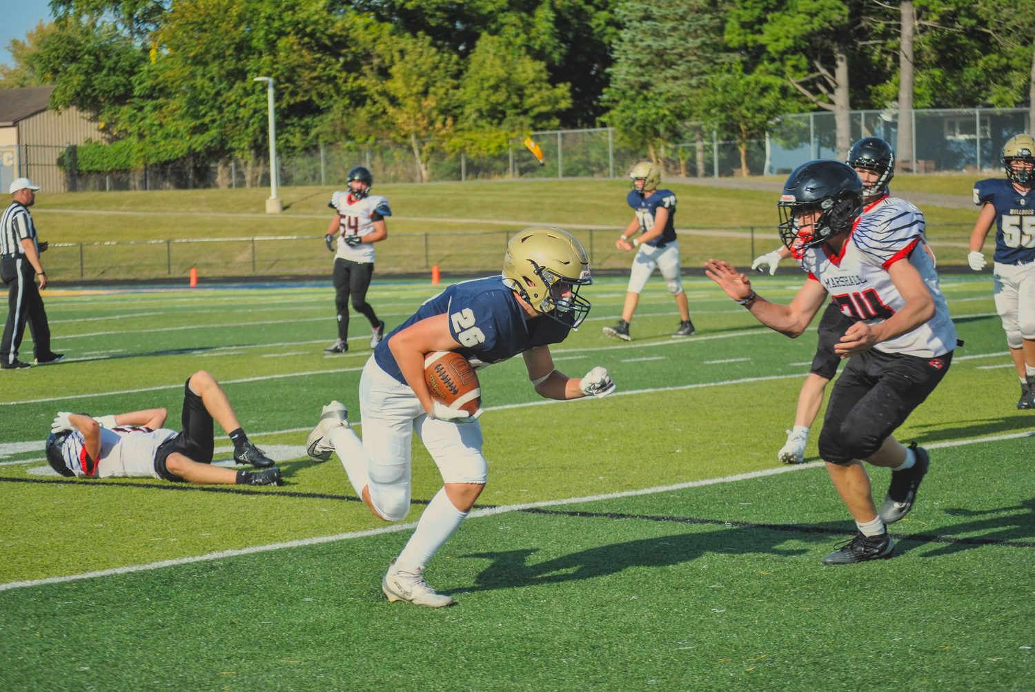 Football player running with the ball during a game